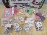 a box of beads and other items sitting on a table