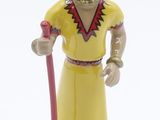 figurine of a man in a yellow outfit with a red staff