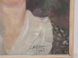 portrait of a woman in a white blouse and black and white scarf