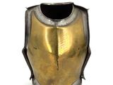 a close up of a gold and silver helmet on a white background