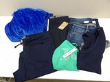 a pile of clothing that is on a table