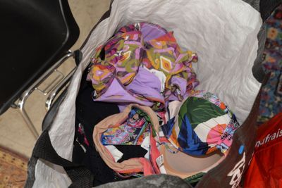 a bag full of clothes and other items in it