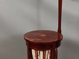 a small table with a lamp on top of it