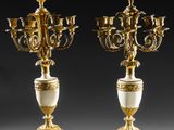 a pair of antique brass and marble candelabs