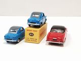 three toy cars that are sitting on top of a box