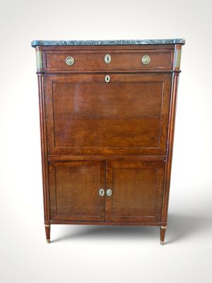 an antique wooden cabinet with marble top and drawers