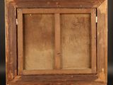 an old wooden easel with a painting on it on a black background