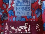 a close up of a tie with a horse drawn carriage on it