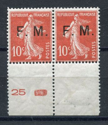 a couple of stamps that are sitting on top of a table