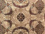 a close up of a rug with many different colors and patterns