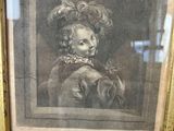 an old picture of a man with a hat and a scarf in a gold frame