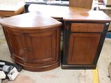 two cabinets that are sitting next to each other in a room