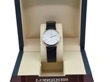 the watch is in a box with a black strap
