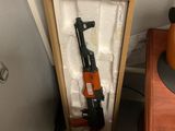a gun that is in a box on a table