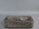 an image of a stone ashtray with two ashtrays in it