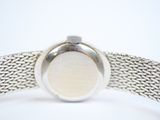an image of a close up of a watch on a white surface