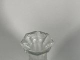 a clear glass vase that is sitting on a table