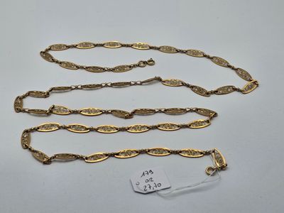 a collection of five gold chains