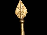 a close up of a gold object on a black background