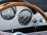 a steering wheel and gauges in a classic car