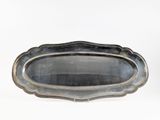 a silver tray that is sitting on a white surface
