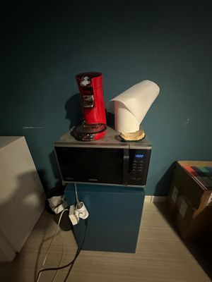 a microwave sitting on top of a microwave oven