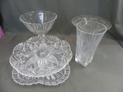 two glass vases and a plate on a table