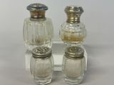 two salt and pepper shakers sitting on a table