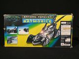 a box with a batmobile in it on a black background