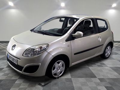 a picture of a small silver car parked in a garage