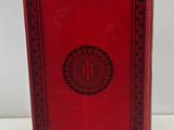a red book sitting on top of a white table