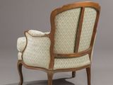 a chair with a wooden frame and upholstered upholstered seat
