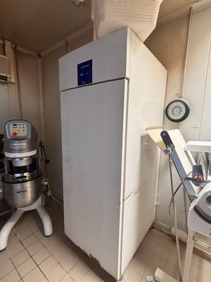 an image of a kitchen with a mixer and a refrigerator