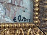 a picture of a gold frame with a painting on it