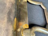 a close up of a metal handle on a piece of luggage
