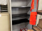 a large open storage cabinet in a garage