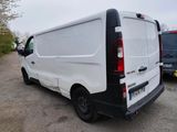 a white van that is parked in a parking lot