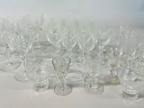 a lot of wine glasses sitting on a table