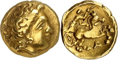 a gold coin with an image of a man riding a horse
