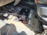 a picture of a car that has a broken battery in it