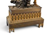 a statue of a man sitting on top of a box