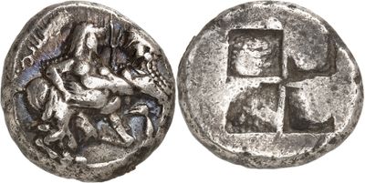 a silver coin with an image of a man on a horse