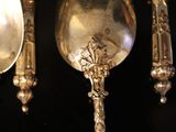 many spoons and spoon spoons on a black surface
