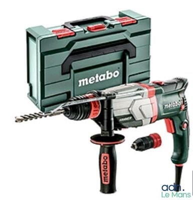 a close up of a hammer with a tool box in the background