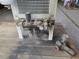 a machine that is sitting on a pallet in a garage