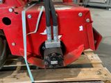 a large red machine that is sitting on a pallet
