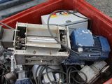 a red container filled with assorted electrical equipment