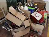 a pile of boxes and other items on the floor