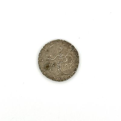 une vieille pièce de monnaie sur laquelle figure un homme, sur un fond blanc