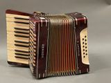 an image of a close up of an accordion on a table